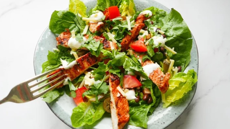 Plate of cajun chicken salad with fork