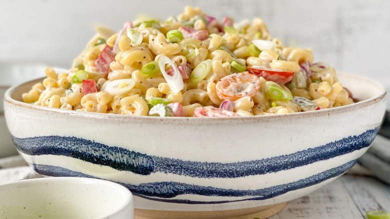 Bowl piled high with creamy macaroni salad