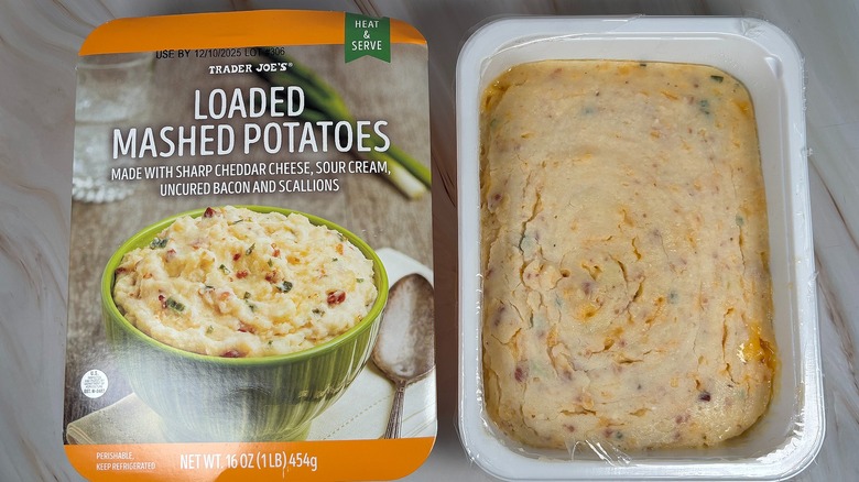 Trader Joe's Loaded Mashed Potatoes next to packaging on marbled surface
