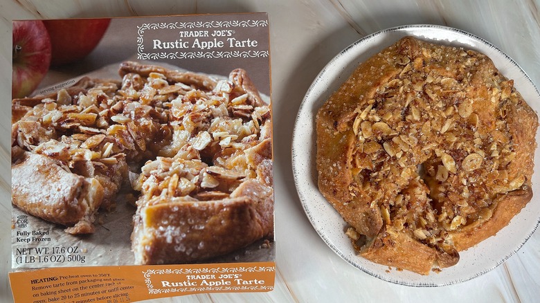 Trader Joe's Rustic Apple Tarte next to packaging on marbled surface