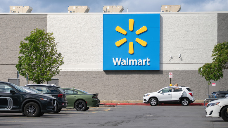 View of Walmart Supercenter parking lot with a store sign on the front wall