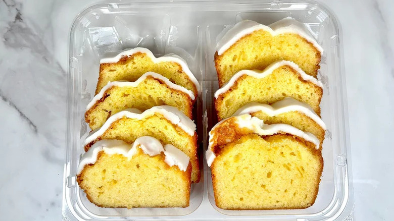 Bakery iced lemon cake sliced and packed in a plastic packaging