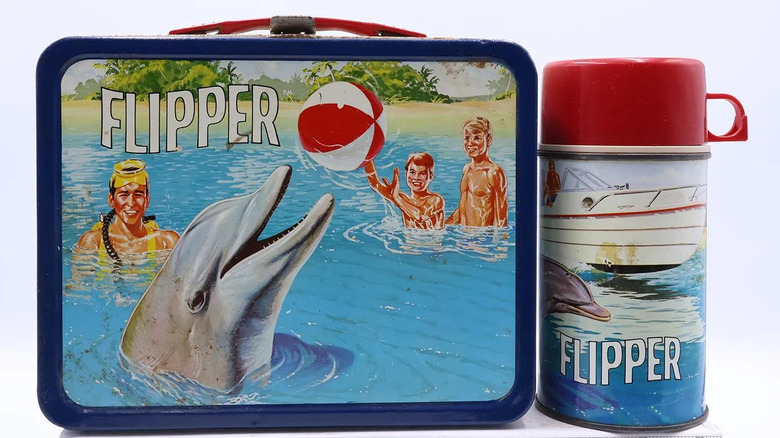 Product shot of the "Flipper" lunchbox and thermos from 1967