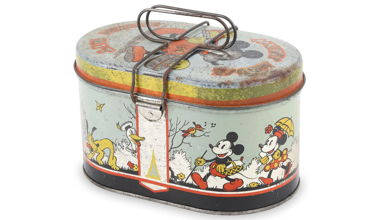 Product shot of a Mickey Mouse lunchbox from 1935 against a white background