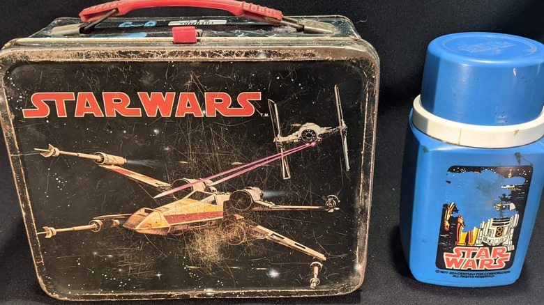Product shot of a "Star Wars" lunchbox and thermos from 1977