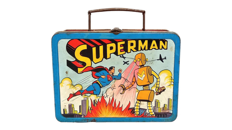 Product shot of a Superman lunchbox from 1954 against a white background