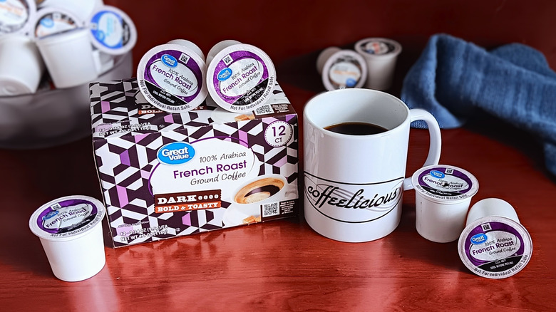 Great Value French Roast coffee pod box, surrounded by loose pods and a mug of black coffee