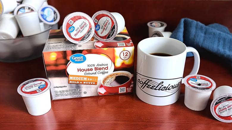 Great Value House Blend coffee pod box, surrounded by loose pods and a mug of black coffee