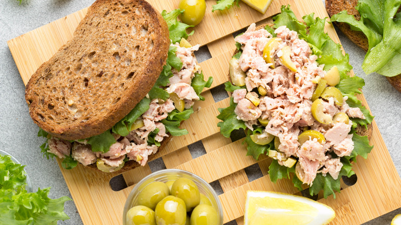 Tuna salad sandwiches on wood board