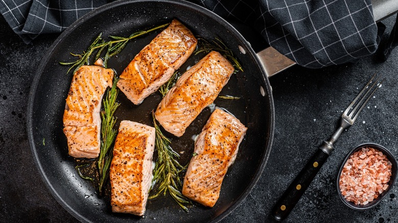 Cooked salmon in frying pan