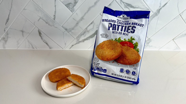 Kirkwood breaded chicken breast patties on a plate with product bag alongside