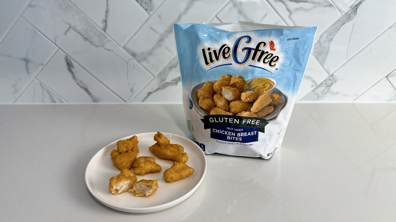 Aldi live G free gluten free chicken breast bites on a plate with product bag alongside