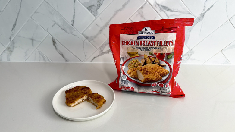 Kirkwood breaded chicken breast fillets on a plate with product bag alongside