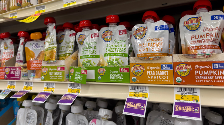Variety of organic squeezable vegetable purees on grocery store shelf