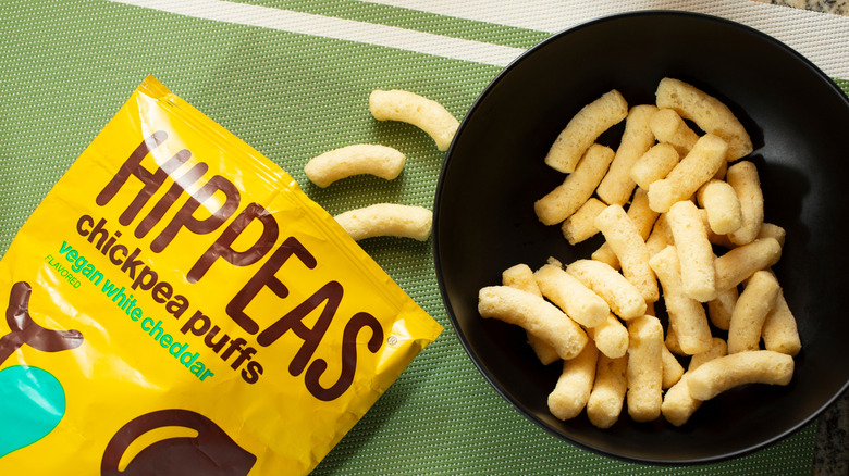 Hippeas bag beside bowl with puffs