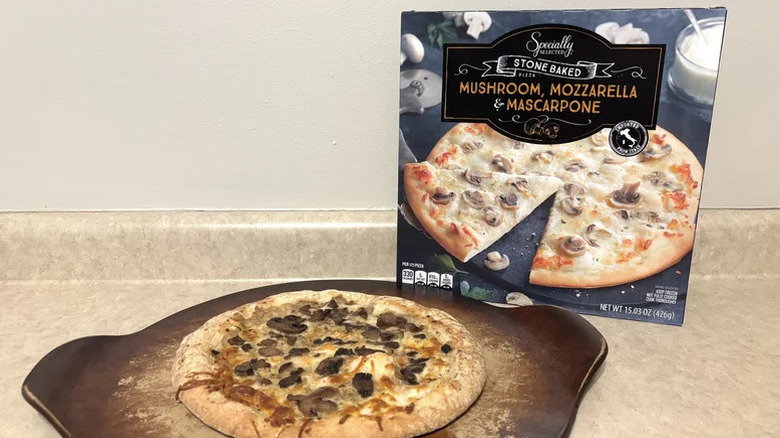 A whole mozzarella, mushroom, and mascarpone pizza