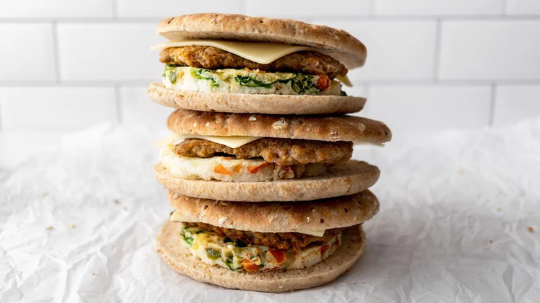 Copycat Dunkin' Donuts Power Breakfast Sandwiches stacked on parchment paper