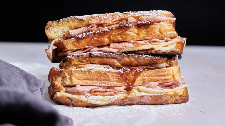 Savory and Sweet Monte Cristo Sandwich stacked on table