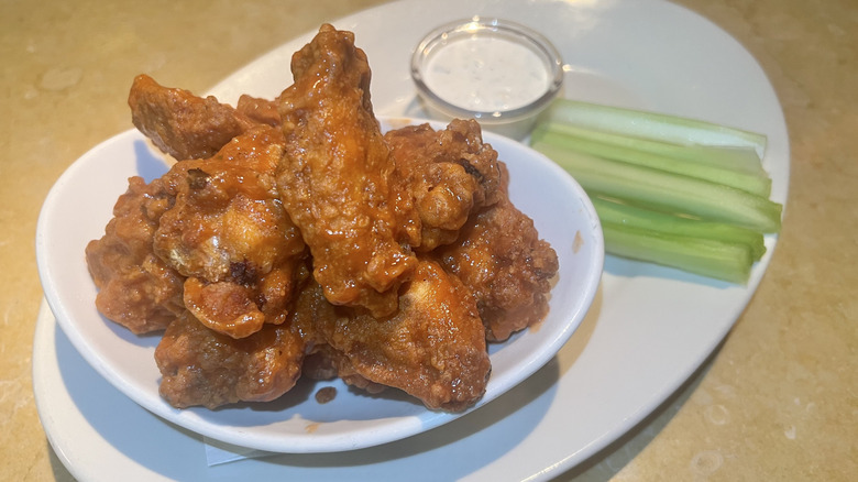 dish of Buffalo Wings with celery
