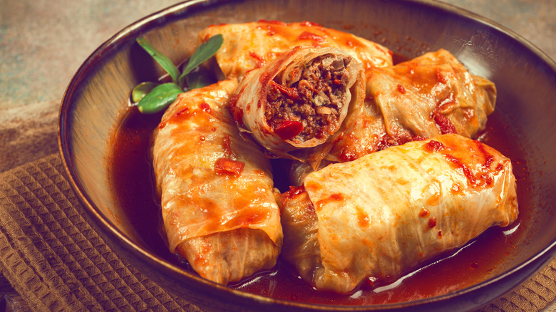 Meat-filled stuffed cabbage rolls in dish