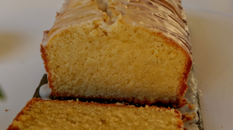 Close up of sliced pound cake with icing glaze