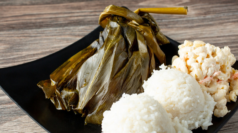 Hawaiian lau lau on plate with rice and macaroni salad