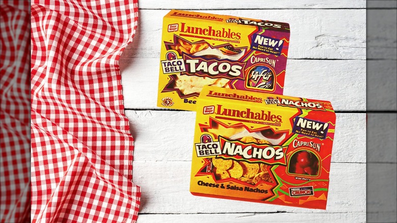 A Taco Bell Taco and Nacho Lunchables on a white background next to a red gingham tablecloth.