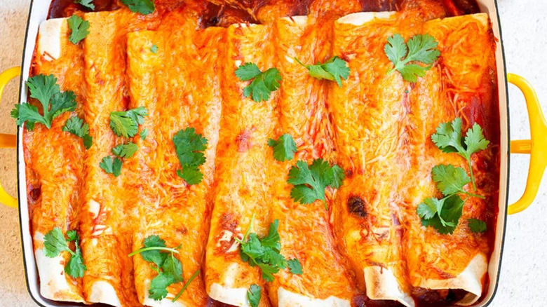 Easy Chicken Enchilada in while and yellow baking dish