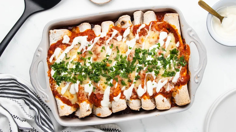 Hearty Mushroom Enchiladas in white casserole dish