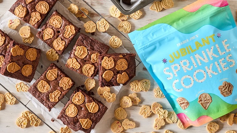 Bag of Trader Joe's Jubilant Sprinkle Cookies next to brownies topped with cookies