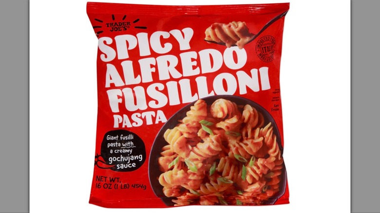 Red bag of Trader Joe's Spicy Alfredo Fusilloni Pasta on white background