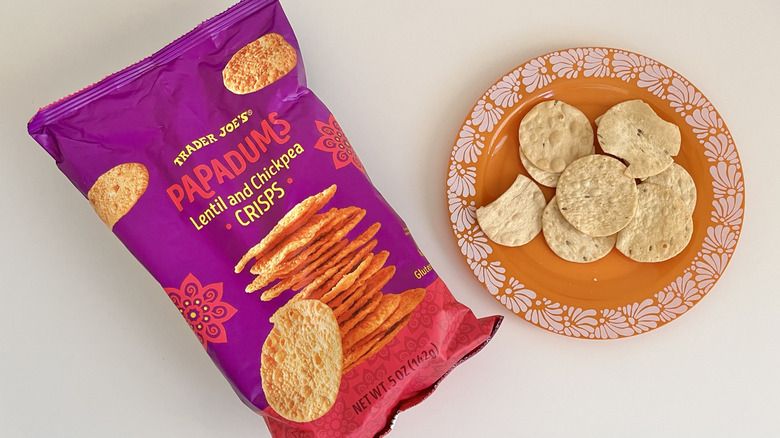 Several Trader Joe's Papadums Lentil and Chickpea Crisps on plate next to a whole bag