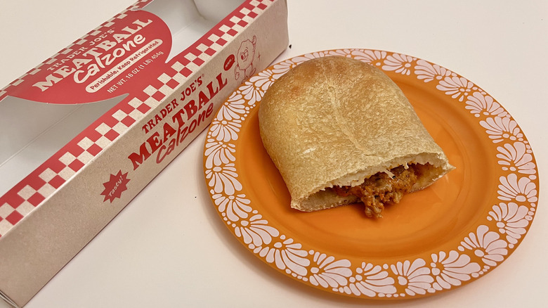 Slice of Meatball Calzone from Trader Joe's on a plate with packaging on the side
