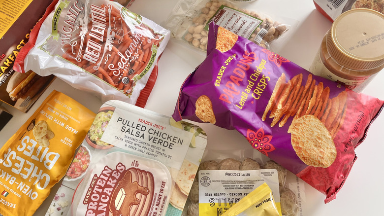 Top view of various potein-packed products from Trader Joe's on a table