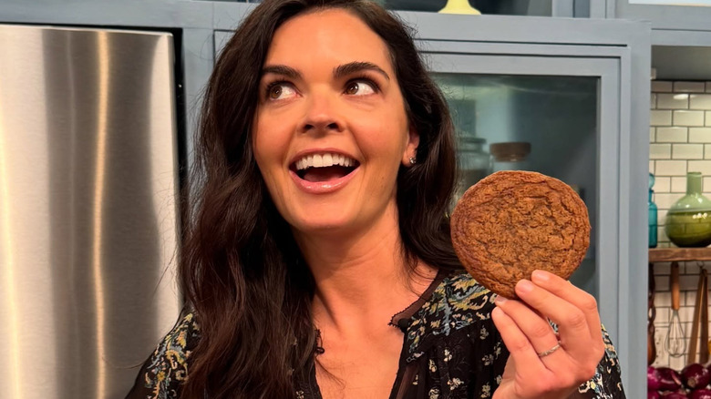 Katie Lee holding a cookie