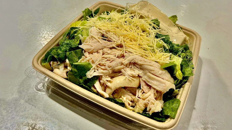 Shredded chicken and parmesan cheese atop bed of crisp Romaine lettuce