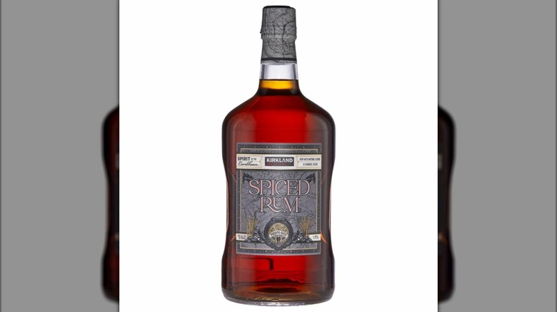 Bottle of amber-brown Kirkland spiced rum