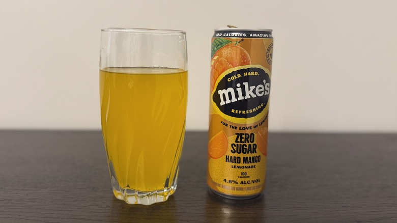 Mango Zero Sugar Mike's Hard Lemonade in a glass and a can.