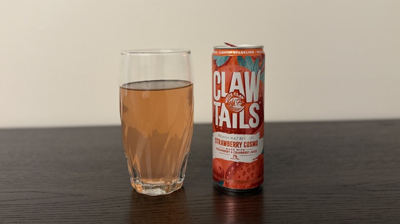 Strawberry Cosmo White Claw Clawtail in a glass and a can.