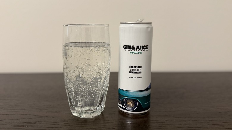 Citrus Gin & Juice by Dre and Snoop in a glass and a can.