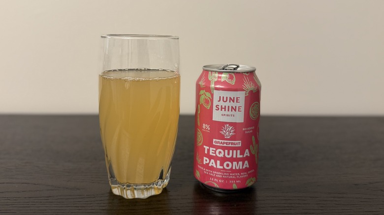 Tequila Paloma JuneShine in a glass and a can.