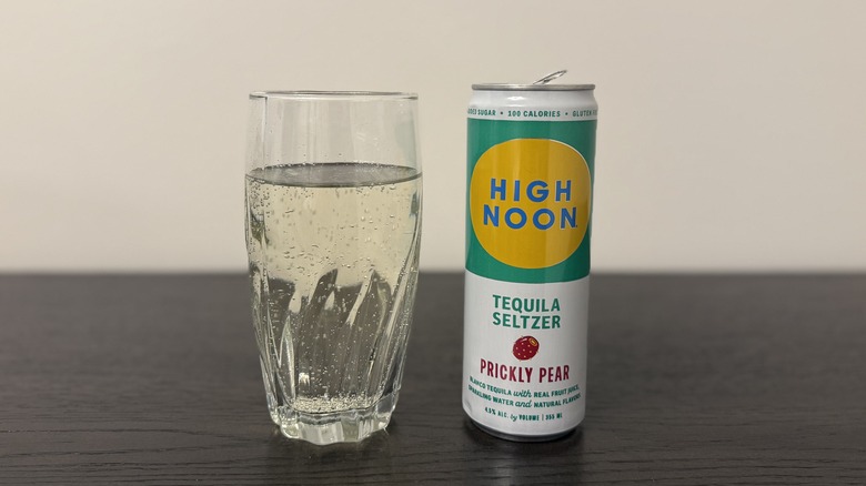 Prickly Pear High Noon Tequila Seltzer in a glass and a can.