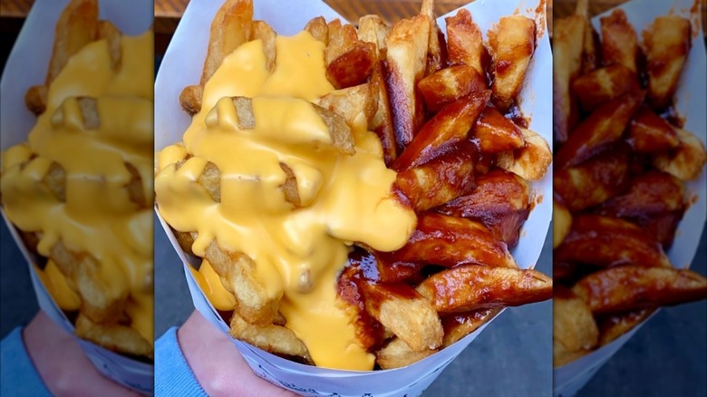 Cone of fries with toppings from Pommes Frites