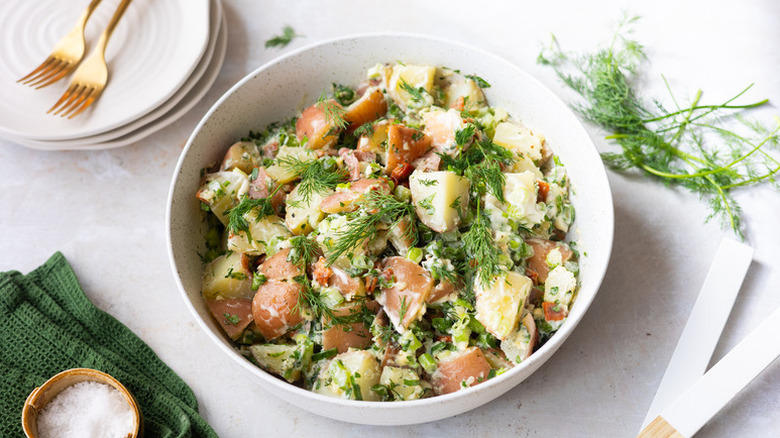 Bowl of red potato salad with fresh dill