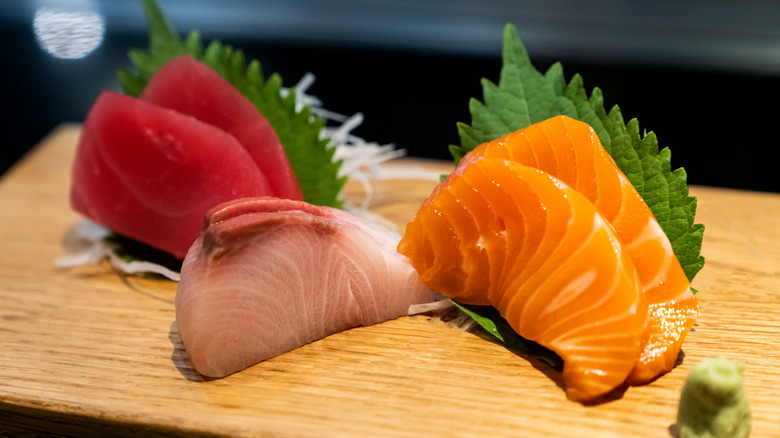 A close-up of a classic Japanese food dish showcasing three types of raw food