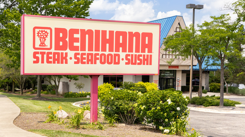 A shot of Benihana's large sign with the restaurant shown in the background