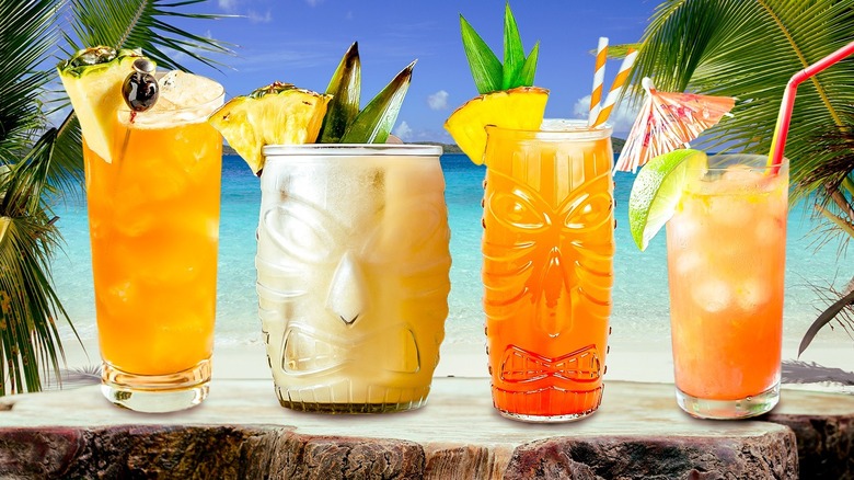 Tiki drinks on tropical background