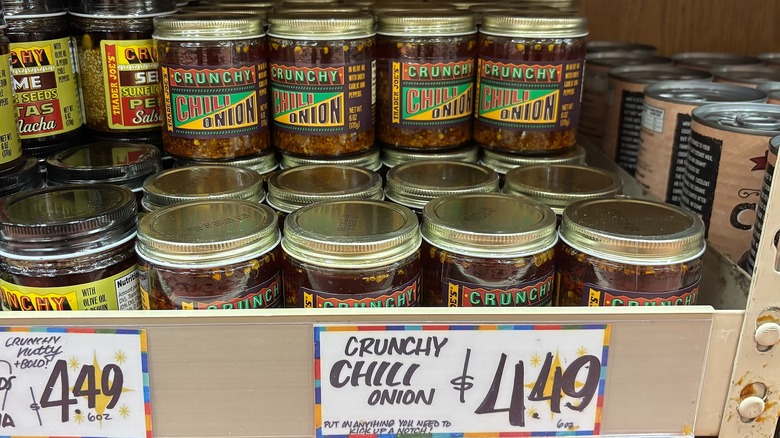 Jars of Trader Joe's Crunchy Chili Onion on shelf in store