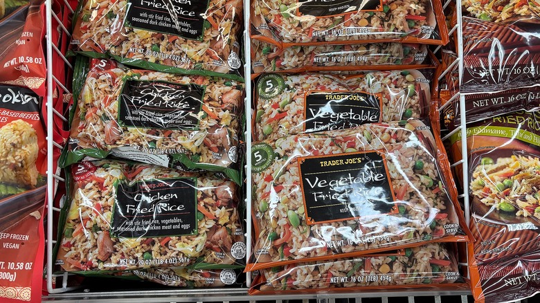 Bags of Trader Joe's Chicken and Vegetable fried rice in store freezer
