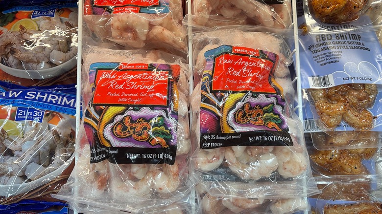 Bags of Trader Joe's raw Argentinian red shrimp in store freezer